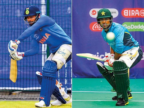 Indian skipper Virat Kohli (left) and his Pakistan counterpart Sarfraz Ahmed at the nets in Old Trafford.