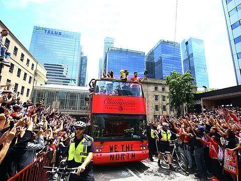 Kyle Lowry #7 and Fred VanVleet #23 of the Toronto Raptors with the championship trophy during the Toronto Raptors Victory Parade on June 17, 2019 in Toronto, Canada.