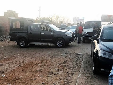 Policemen guard outside the cemetery where Egypt's deposed president Mohammad Mursi was buried.