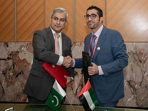 Nasser Bin Thani Al Hameli, UAE Minister of Human Resources and Emiratisation and Tahir Hussain Andrabi, Acting Permanent Representative of Pakistan to the United Nation at the singing of MoU in Geneva.