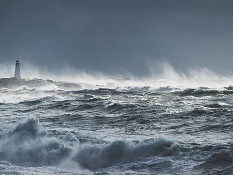 Giant waves break near the lighthouse at Peggy's Cove, Nova Scotia.