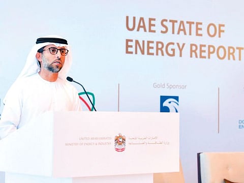 Suhail Al Mazroui speaks at the event in Abu Dhabi yesterday. The minister said the build-up in US inventories necessitates an extension of the output cut deal.