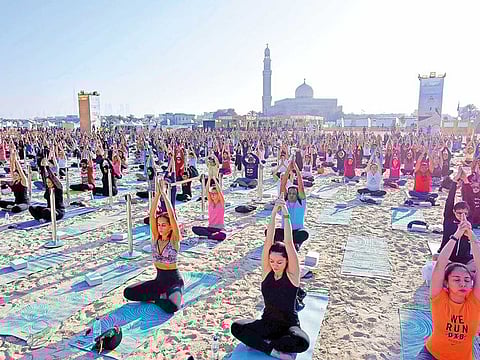 Hundreds of people gather at Kite Beach, Dubai to participate in the Xyoga Festival