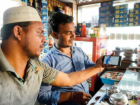 Indians watch a live broadcast of the Cricket World Cup in Hyderabad. 5G can offer better user experience in streaming, gaming and entertainment.