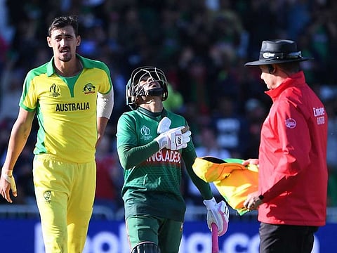 Bangladesh's Mushfiqur Rahim celebrates reaching his century during the 2019 Cricket World Cup group stage match between Australia and Bangladesh at Trent Bridge in Nottingham, central England, on June 20, 2019.