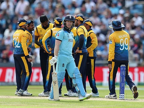 England's captain Eoin Morgan leaves the field after being dismissed during the Cricket World Cup match between England and Sri Lanka in Leeds, England.