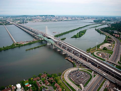 Aerial image of the new Champlain Bridge in Montreal next to the old Champlain Bridge (front) on June 21, 2019.