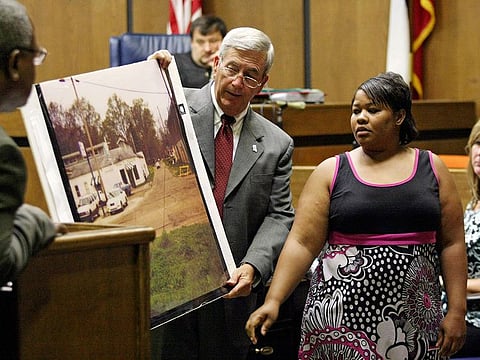 Clemmie Flemming points out to prosecutor Doug Evans, center, where she spotted Curtis Giovanni Flowers on the morning of four slayings at Tardy Furniture in Greenwood
