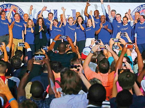 After delivering their speeches, members of the Democratic presidential field join together on stage at Representative Jim Clyburn’s annual fish fry event in Columbia on Friday.