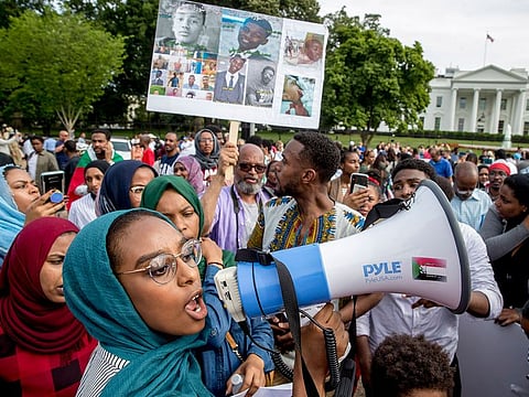 Sudanese Americans rally outside the White House in Washington, Saturday, June 8, 2019, in solidarity with Pro-democracy protests in Sudan.
