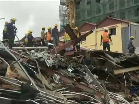 Three people are confirmed dead, while dozens are feared buried in Cambodia building collapse.