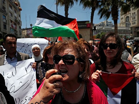 Palestinians take part in a protest against the U.S.-led economic workshop for Mideast plan that is hosted by Bahrain, in Ramallah in the Israeli occupied West Bank