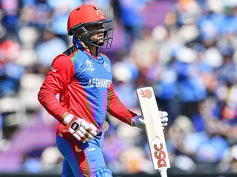 Afghanistan's captain Gulbadin Naib walks back to the pavilion after his dismissal during the group stage match against India at the Rose Bowl in Southampton.