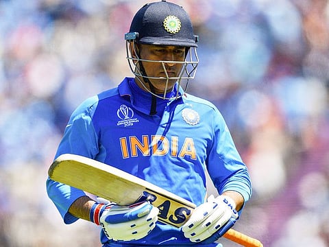 India's Mahendra Singh Dhoni walks back to the pavilion after his dismissal during the match against Afghanistan at the Rose Bowl in Southampton.