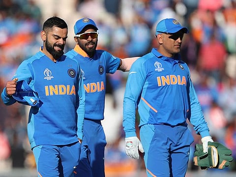 India's captain Virat Kohli, left, celebrates their win as he leaves the field with teammates at the end of the match against Afghanistan at the Hampshire Bowl in Southampton, on Saturday, June 22, 2019.