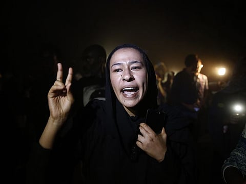 A Sudanese protester shouts slogans against the military council, as they march during demonstration, in Khartoum, Sudan, Wednesday, June 19, 2019.