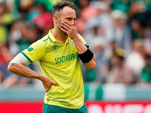 South Africa's captain Faf du Plessis waits for the arrival of the incoming batsman after the dismissal of Aiden Markram during the World Cup group stage match against Pakistan at Lord's Cricket Ground in London on June 23, 2019.