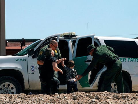 Migrants from Brazil turn themselves into US Border Patrol agents to claim asylum after crossing the Rio Grande as seen from Ciudad Juarez, State of Chihuahua, Mexico.