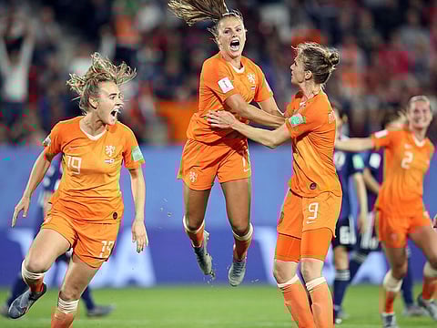 Netherlands' Lieke Martens, centre, celebrates after scoring her side's second goal from the penalty spot.