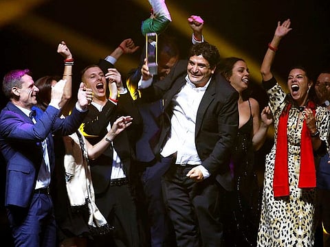 Chef-owner of Mirazur restaurant Mauro Colagreco and his team react after receiving the award for Best Restaurant during the World's 50 Best Restaurants Awards at the Marina Bay Sands in Singapore