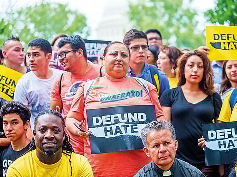 Activists join in a protest to denounce the Trump administration’s immigration policies in Washington.