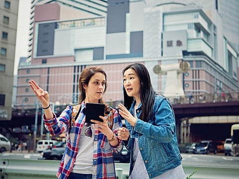 Young caucasian girl is lost in Japan and asking local mature woman for help