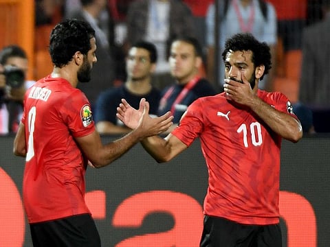 Egypt's Mohammad Salah (R) celebrates with Marwan Mohsen.