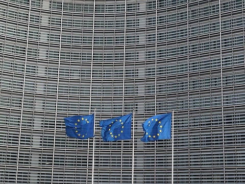 European Union flags fly outside the European Commission headquarters in Brussels, Belgium.