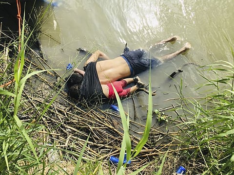 The bodies of Salvadoran migrant Oscar Alberta Martinez Ramirez and his nearly 2-year-old daughter Valeria lie on the bank of the Rio Grande in Matamoros, Mexico, Monday, June 24, 2019, after they drowned trying to cross the river to Brownsville, Texas. Martinez' wife, Tania told Mexican authorities she watched her husband and child disappear in the strong current.