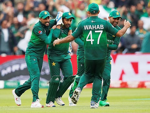 Pakistan's Sarfaraz Ahmad celebrates with team mates after taking a catch to dismiss New Zealand's Ross Taylor during their match at Edgbaston, Birmingham.