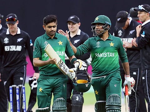 Pakistan's captain Sarfaraz Ahmad, right, pat on the shoulder teammate Babar Azam for scoring a century at the end of their match against New Zealand at the Edgbaston Stadium in Birmingham.
