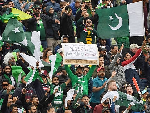 Pakistan supporters cheer during the World Cup group stage match against New Zealand at Edgbaston in Birmingham.
