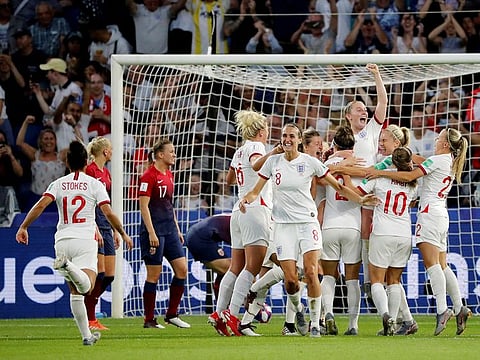 England's Lucy Bronze celebrates scoring their third goal with Keira Walsh, Jill Scott and team mates.