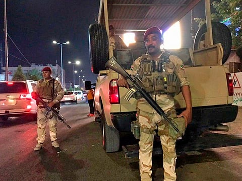 Iraqi security forces stand guard near Bahraini embassy in Baghdad, Iraq, Thursday, June 27, 2019.