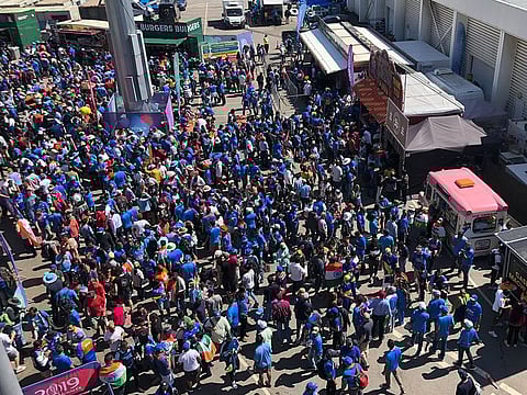 Fans, mostly Indians, swarm the food kiosks at the Old Trafford cricket ground during the lunch interval on Thursday.