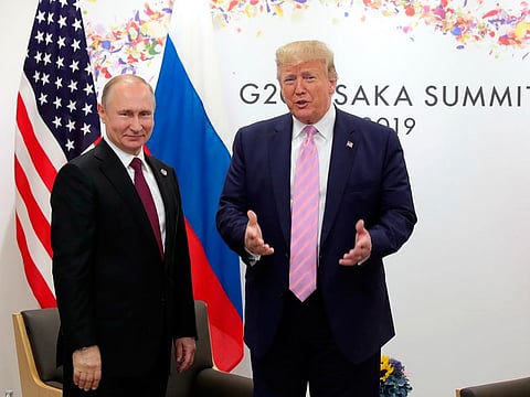 President Donald Trump, right, and Russian President Vladimir Putin pose for a photo during a bilateral meeting on the sidelines of the G-20 summit in Osaka, Japan, Friday, June 28, 2019.