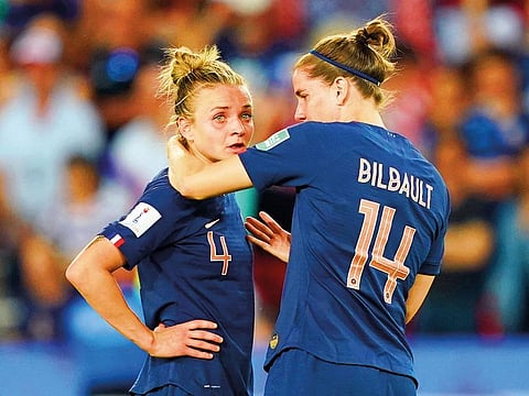 France’s Marion Torrent (left) is comforted by Charlotte Bilbault after the loss against USA in Paris.