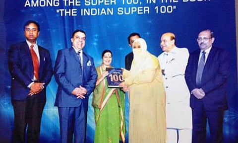 Morphed image showing Heera Group CEO Nowhera Shaik receiving the book from Sushma Swaraj