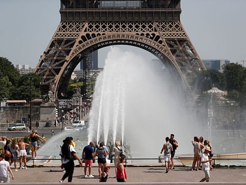 Tourists near the Trocadero Fountain in Paris during a heatwave on June 28, 2019. The temperature in France on June 28 surpassed 45 degrees Celsius for the first time as Europe wilted in a major heatwave, state weather forecaster Meteo-France said.