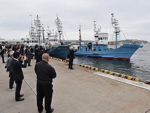 Well-wishers watch as whaling ships depart from a port in Kushiro, Hokkaido Prefecture on July 1, 2019.