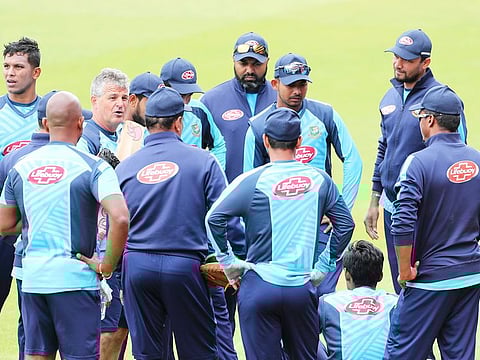 Bangladesh players listen to team coach Steve Rhodes, third left, during a training session ahead of their World Cup match against India at Edgbaston in Birmingham.