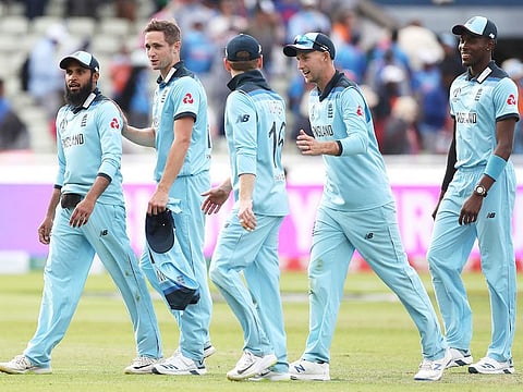 England players leave the field as they celebrate their win over India in the World Cup match at Edgbaston in Birmingham.