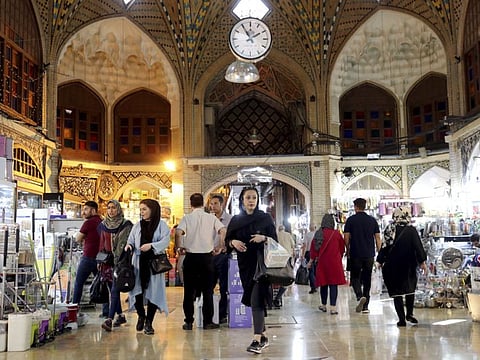People shop at the old main bazaar in Tehran, Iran, on June 23, 2019. The most-visible place to see the effect of the economic hardship most face comes from walking by any money-exchange shop. Depreciation and inflation makes everything more expensive, from fruits and vegetables to tyres and oil all the way to the big-ticket items, like mobile phones.
