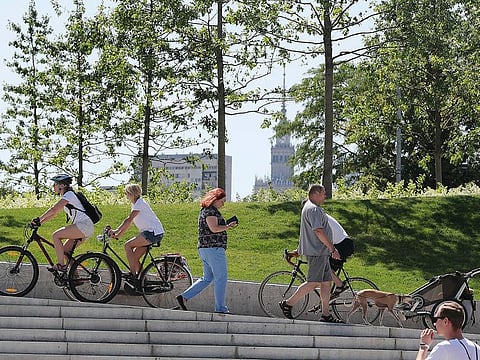 People cool off by the Vistula River during a heatwave in Warsaw, Poland.