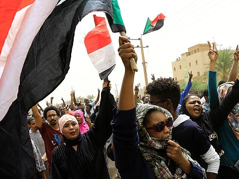 Sudanese shout slogans during a demonstration demanding the ruling military hand over to civilians in Khartoum, Sudan, June 30, 2019.