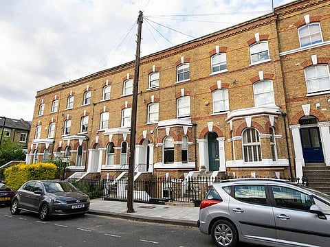 General view of the road in Clapham, south London, where the body of a suspected stowaway is believed to have fallen from a passenger plane and was found in a garden, after police attended Sunday following the discovery.
