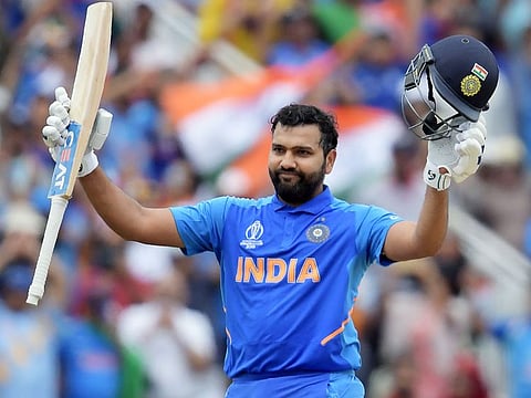 India's Rohit Sharma celebrates after scoring a century during the World Cup group stage match against Bangladesh at Edgbaston in Birmingham.