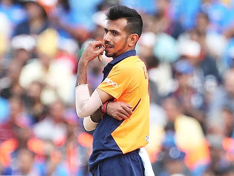 India's Yuzvendra Chahal reacts after a boundary hit by England's Jason Roy during their World Cup match at Edgbaston in Birmingham.