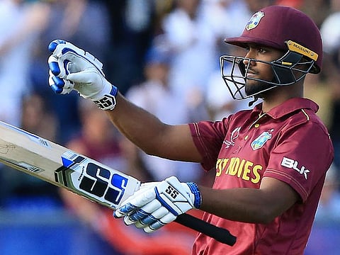 West Indies' Nicholas Pooran celebrates after scoring a century during the World Cup group stage match against Sri Lanka at the Riverside Ground, in Chester-le-Street.