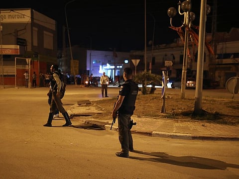 Armed personnel are seen after a man reported to be wearing an explosive belt died in the Mnihla area in Tunis, Tunisia July 2, 2019.